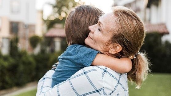 Mother hugging her son